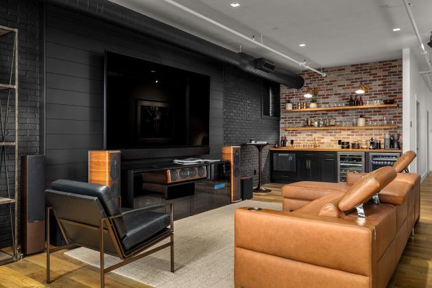 Eyehear Showroom living room with TV, speakers and suede furniture